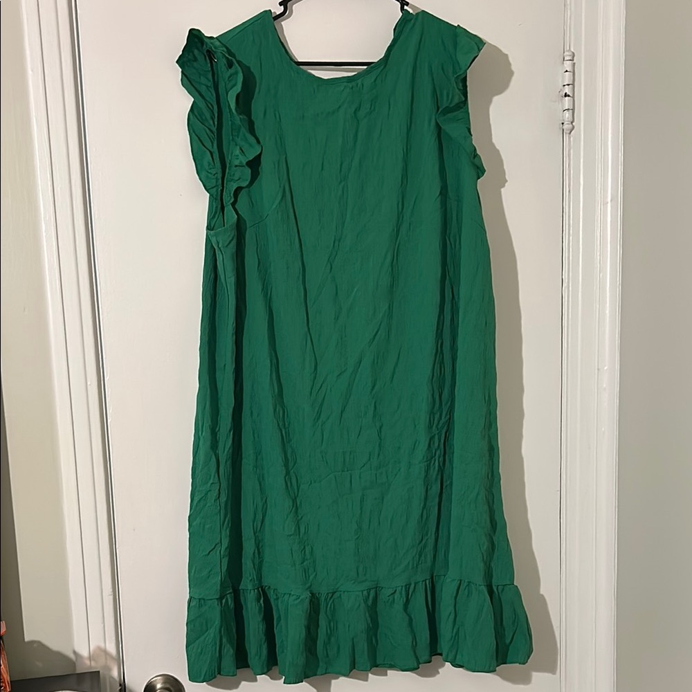 Green knee-length sundress with ruffled tiered details and flutter sleeves